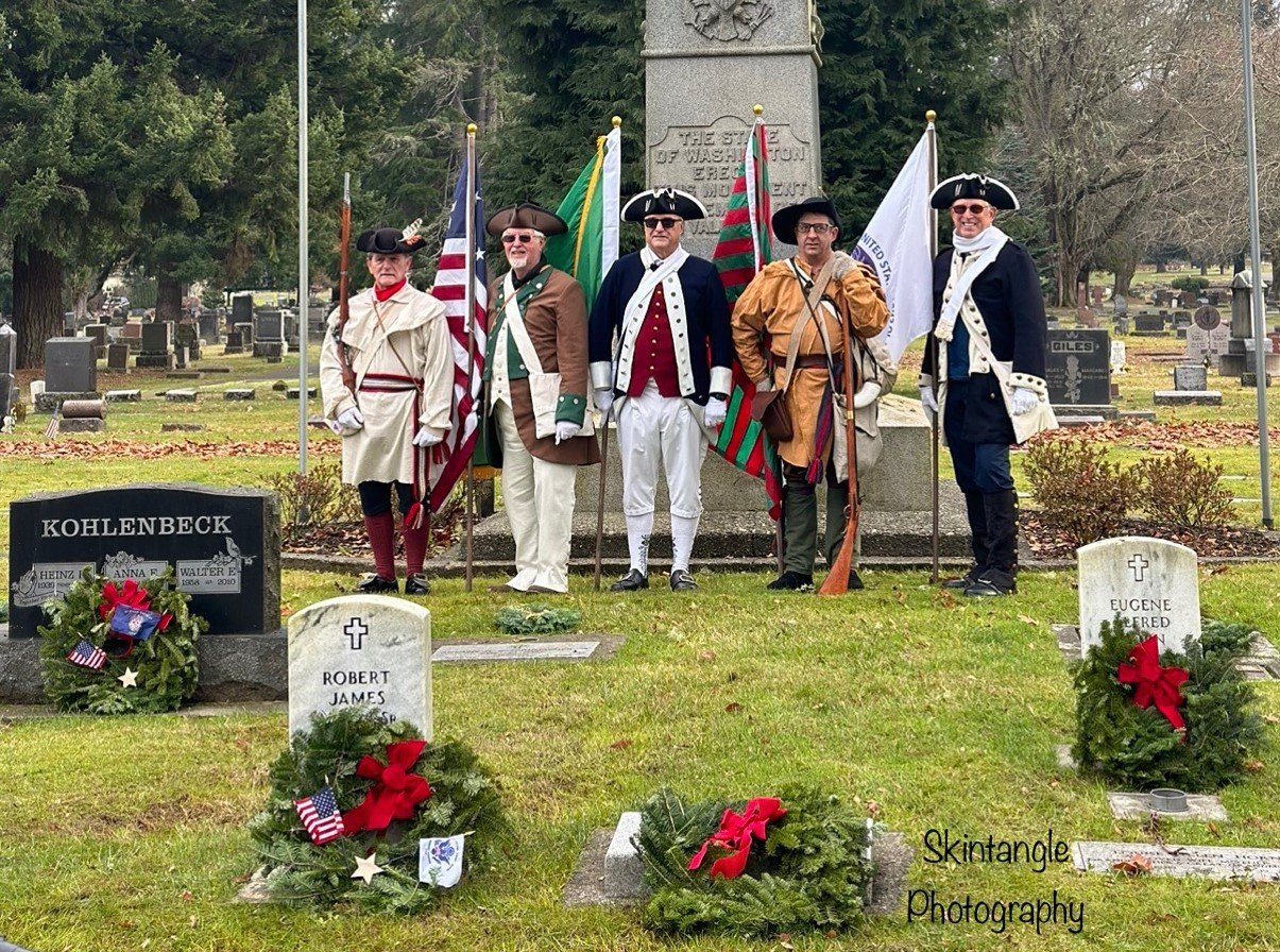 George Rogers Clark Chapter SAR Color Guard at the monument. (L-R) Joe Coorough, Lew Maudsley, Dick Moody, Eric Olsen, Art Dolan,  Judi Hine also participated, carrying a DAR flag of the 250th Anniversary of the USA, 1776-2026.